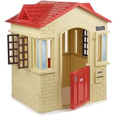 a toy house with a red roof and windows