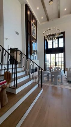 a living room filled with furniture and a staircase