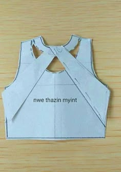 an origami top with the words nwe thaziin mynt on it