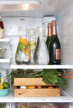 an open refrigerator filled with lots of food and drinks