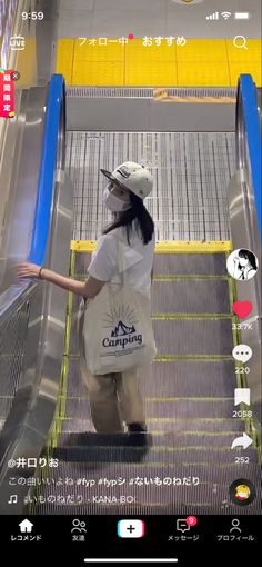 a woman riding an escalator down a flight of stairs wearing a white shirt