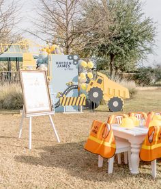 there is a white table with orange safety vests on it and a sign in the background