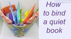 an origami book holder filled with colorful pens and pencils on top of a white table