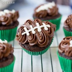 cupcakes with chocolate frosting and white crosses on them