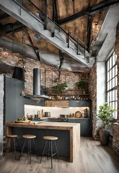 an industrial style kitchen with exposed brick walls and wooden flooring, along with two stools