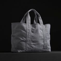 The perfect carry all tote bag with an inside pocket and comfortable shoulder straps. This bag is constructed from thick, durable canvas that is ideal for everyday use.Additional Information:• 40% Cotton, 40% Linen, 20% Polyurethane. • Imported• Width: 24 in. Height: 13 in. • Inside Pocket Width: 10 3/4 in. Height: 8 1/2 in. • Shoulder Strap Drop: 8 in. • Spot clean. Practical Weekender Tote Bag With Pockets, Functional Canvas Tote Bag With Top Handle, Functional Canvas Tote Bag With Top Carry Handle, Practical Canvas Tote Bag With Reinforced Handles, Functional Cotton Bag With Double Handle, Functional Double Handle Cotton Bag, Functional Solid Canvas Bag For Everyday Use, Functional Canvas Shoulder Bag For Shopping, Functional Cotton Shopping Bags