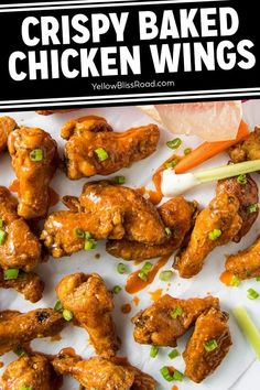 baked chicken wings with carrots, celery and sour cream on the side