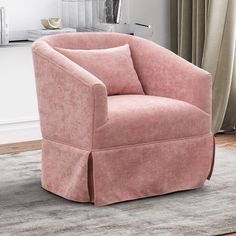 a pink chair sitting on top of a rug