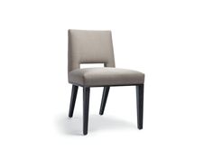 an upholstered chair with black legs and a light colored fabric on the back