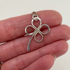 This sterling silver four leaf clover pendant is hand formed.  The leaves are hammered to add texture and width.  This lucky clover pendant is simple and delicate. The pendant comes on a .85 mm wide box link chain with a lobster claw. Please select what length chain you would prefer.  The necklace will be shipped in a decorative cardboard jewelry box filled with an anti tarnish cotton. Sterling silver is a metal that can tarnish, storing it in the box in which it is shipped will help prevent tar 4 Leaf Clover Necklace, Cardboard Jewelry, Lucky Necklace, Clover Pendant, 4 Leaf Clover, Hammered Hoop Earrings, Silver Heart Pendant