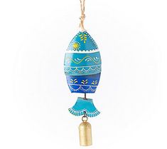 an ornament hanging from a rope on a white background with blue and yellow designs