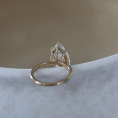 two wedding rings sitting on top of each other