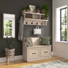 a white bench sitting under a window next to a wooden shelf filled with potted plants