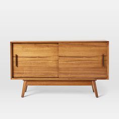 the sideboard is made out of wood and has two doors on each side, one with