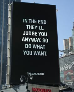 an advertisement on the side of a building that says in the end they'll judge you anyway so do what you want