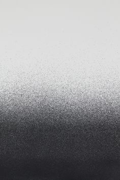 an abstract black and white background with small speckles