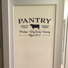 a pantry door with the words pantry printed on it and a cow in the background