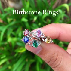 These are beautiful sterling silver birthstone rings, each handmade with the gemstone of your choice. The center gemstone is set in between two hearts, which represent your heart and theirs. This ring is a perfect gift for a best friend, a mother, or even a promise ring to your girlfriend. She'll absolutely love the way it sparkles! They are also comfortable for everyday wear! * Made with Sterling Silver * The Best Colored Gemstones * Free Stylish Ring Box! We personally hand select our gemstone Fine Jewelry Topaz Birthstone Gemstones, Topaz Birthstone Gemstones For Gifts, Dainty Cubic Zirconia Birthstone Promise Ring, Dainty Emerald Open Ring Jewelry, Handmade May Birthstone Ring, Gift Sapphire Open Ring, Oval Cubic Zirconia Stackable Rings, Heirloom Topaz Ring For Promise, Unique Birthstone Gemstones As Gifts