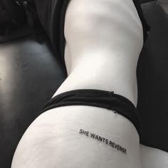 a woman's leg with the words she wants reving written on it, in black and white