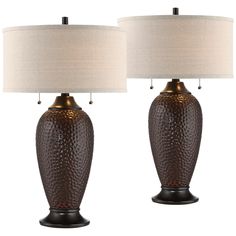 a pair of brown table lamps with white shades