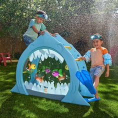 two children playing in a water play area