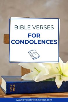 a bible verses for condonces sign sitting on top of two books