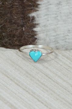 This turquoise and sterling silver heart ring was made by Zuni silversmith A Laio.Size: 4Length: 1/4"Width: 1/4"Free shipping on all orders! We ship with USPS and always include tracking. All orders ship within a day of payment.Returns are accepted up to 30 days after you receive your order. Just send us a message. Our shop offers cash back or store credit. The item must be returned in new condition. Western Outfit, Silver Heart Ring, Sterling Silver Heart, Native American Jewelry, Western Outfits, Turquoise Sterling Silver, Silver Heart, Free Jewelry, Sterling Silver Ring