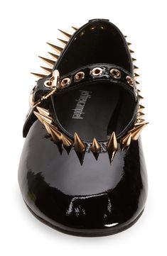 Exaggerated spikes and grommets exude edge on this reimagined mary-jane flat crafted from glossy patent leather. Adjustable strap with buckle closure Leather upper and lining/synthetic sole Imported Rockette Shoes, Shoes With Spikes, Leather Flats With Spikes, Luxury Spiked Sandals, Chic Studded Ballet Flats, Designer Spiked Leather Heels, Shoe References, Flat Slingback Shoes, Whimsical Shoes