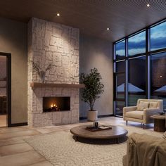 a living room with couches, chairs and a fire place in front of large windows