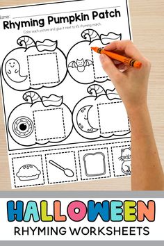 a hand holding a pencil over a halloween themed printable worksheet for kids