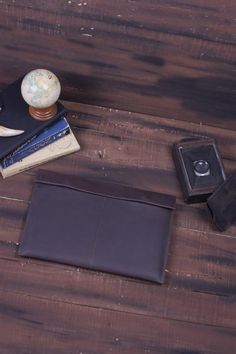 there is a wallet and other items on the table