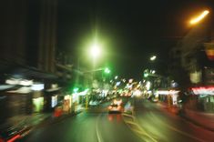 blurry photograph of city street at night