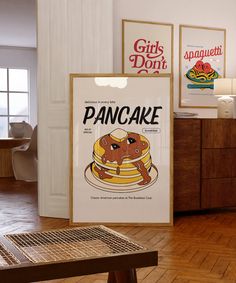 a pancake advertisement hangs on the wall next to a wooden table in a kitchen