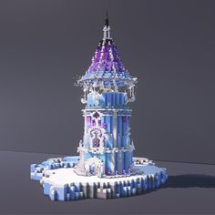 the tower is made out of legos and has snow flakes on its roof