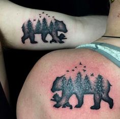 two people with tattoos on their stomachs, one has a bear and the other has trees