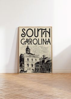 a poster on the wall that says south carolina in black and white with an old building