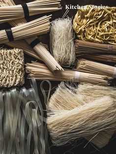 many different types of yarns and other items on a table with the words kitchen stories written above them