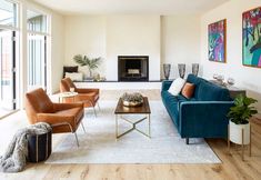 a living room filled with furniture and a fire place in the middle of a room