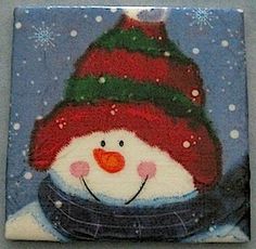 a painting of a snowman with a red hat and scarf on it's face