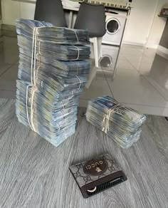 a stack of papers sitting on top of a wooden table