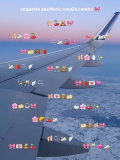 an airplane wing with many stickers on it