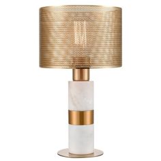 a gold and white table lamp with a marble base