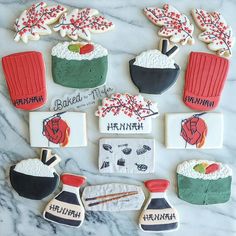 decorated cookies are arranged on a marble surface