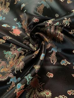 This Chinese brocade dragon fabric is 44/45" wide and composed of 55% nylon and 45% polyester. It's known for its metallic sheen and embroidered appearance, making it great for costumes, decor, fashion, and crafts. You can purchase it by the yard, but be aware that the color may vary by dye lot or batch. It's essential to dry clean this fabric, as it's not suitable for machine washing. Dragon Fabric, Chinese Brocade, Chinese Fabric, Colored Burlap, Lame Fabric, Lace Bag, Duck Cloth, Burlap Lace, Super Rich