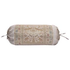 a roll pillow with an embroidered design on the front and side, sitting on a white background