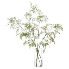 a vase filled with flowers on top of a white table