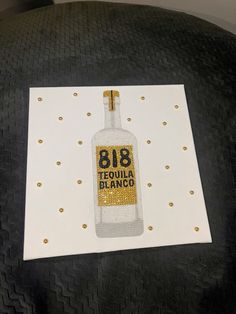 a card with a bottle on it that says 818 tequila blvdd