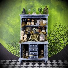 an old fashioned halloween cabinet with decorations on it