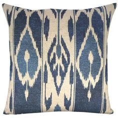 a blue and white pillow with an ornate design on the front, along with a sale tag