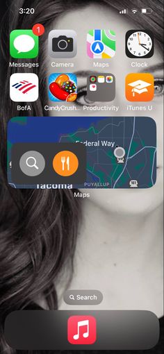 an image of a woman's face with various icons on her cell phone screen